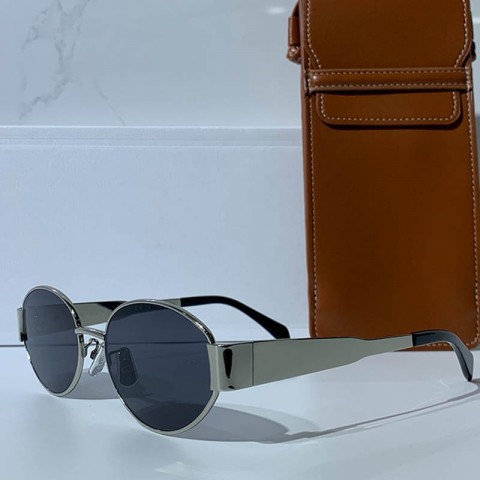 Celins Women's Oval Sunglasses with Gold Legs and Green Lenses