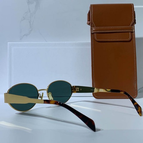 Celins Women's Oval Sunglasses with Gold Legs and Green Lenses